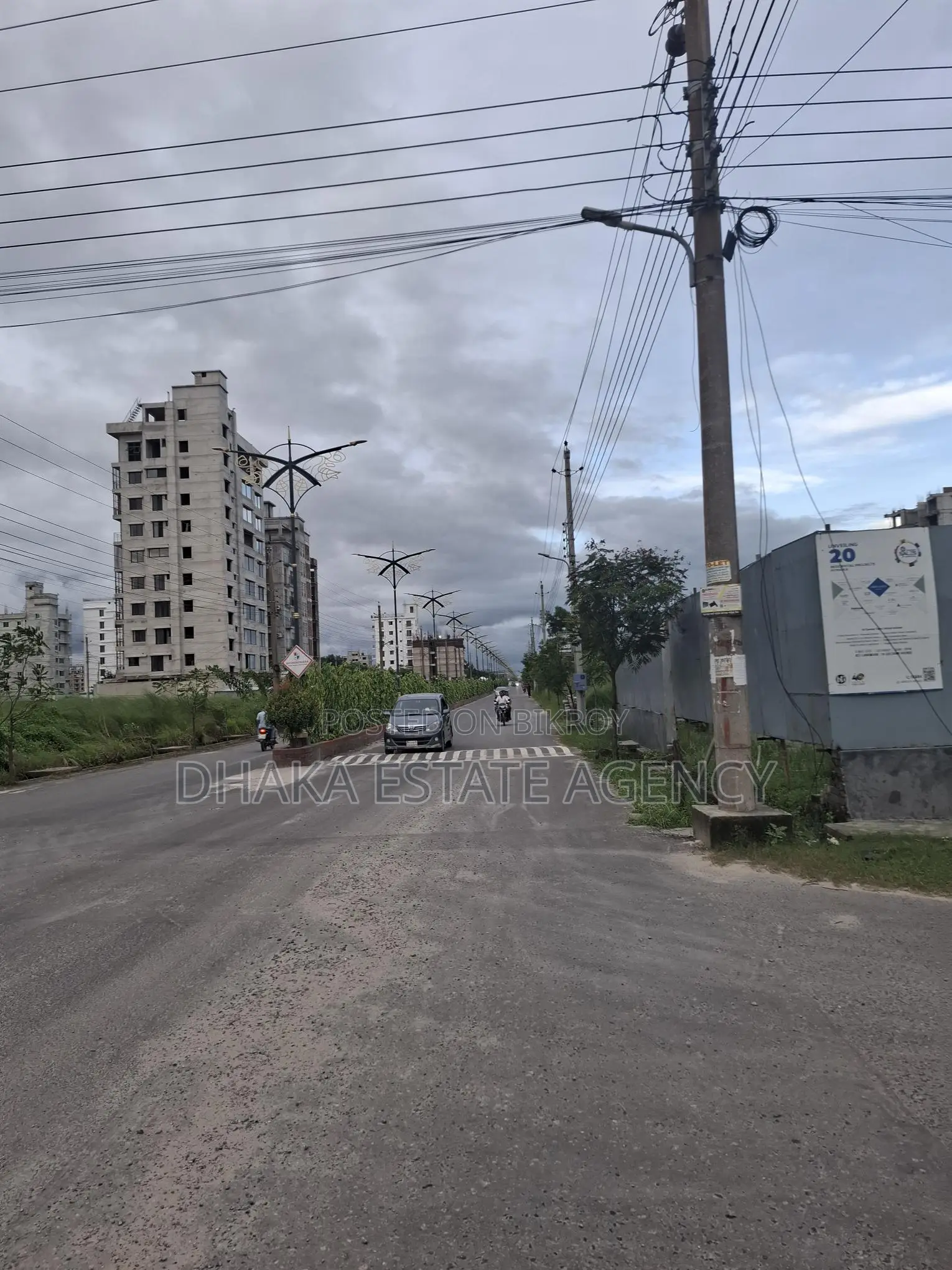 Directly facing the lake and garden, open on south, north, and west sides in Dhaka