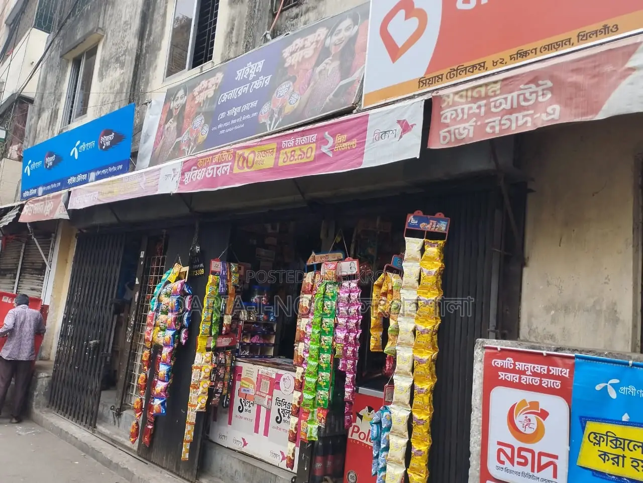 Two-story house with shops for sale in Khilgaon, offering an income opportunity of over 1 lakh in Khilgaon
