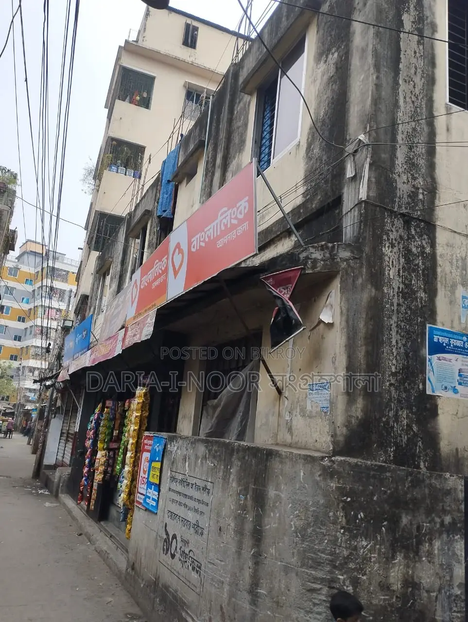 Two-story house with shops for sale in Khilgaon, offering an income opportunity of over 1 lakh in Khilgaon