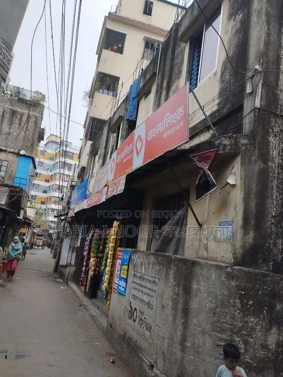 Two-story house with shops for sale in Khilgaon, offering an income opportunity of over 1 lakh in Khilgaon