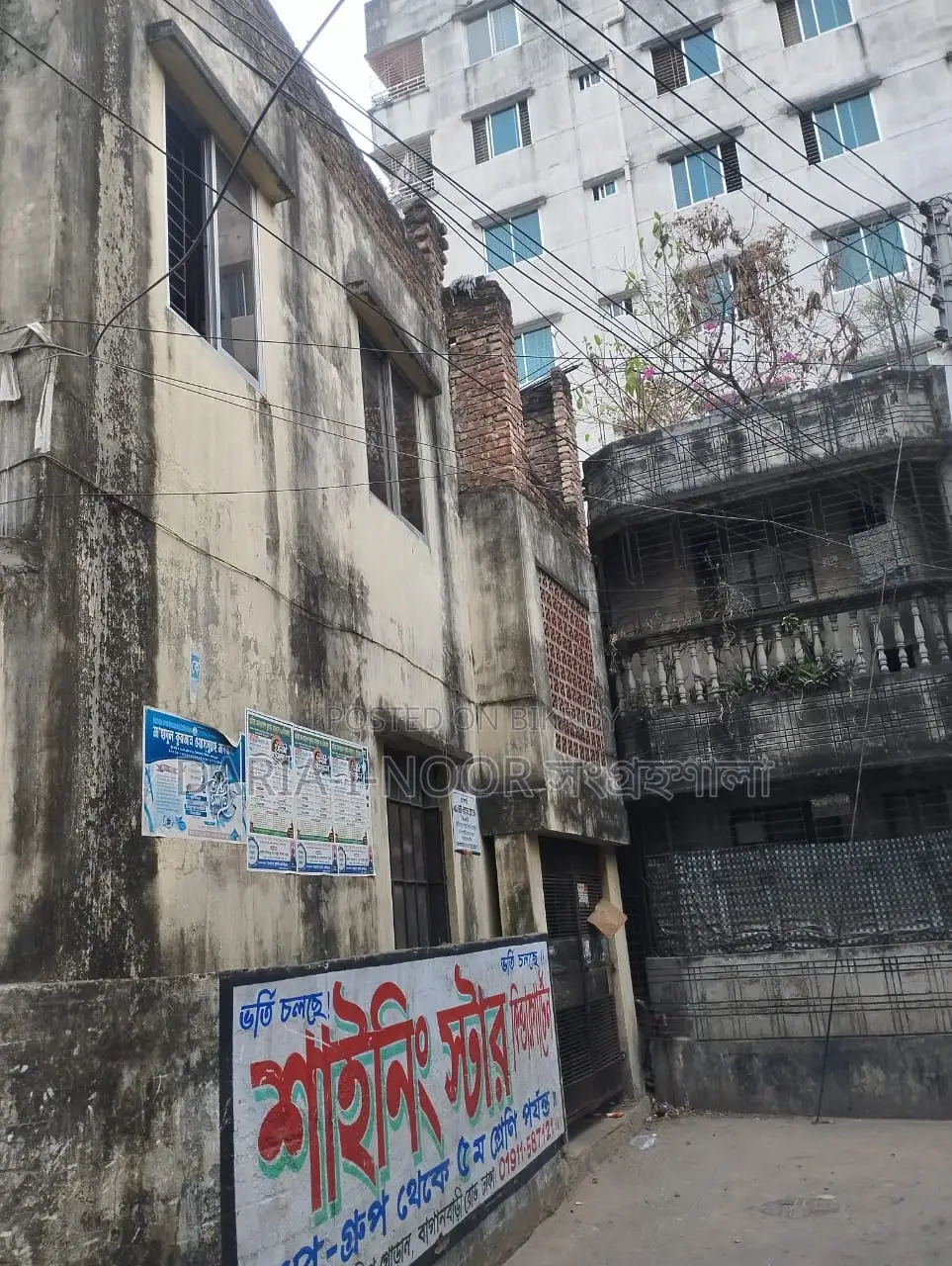 Two-story house with shops for sale in Khilgaon, offering an income opportunity of over 1 lakh in Khilgaon